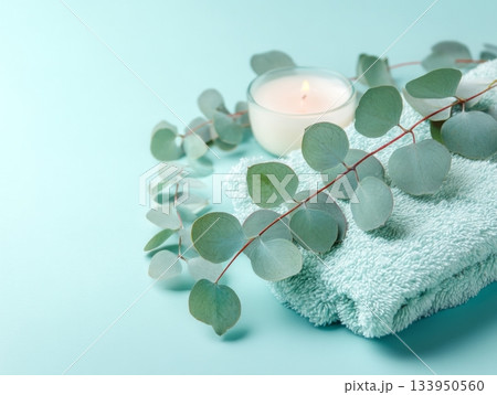 Minimal spa flat lay with eucalyptus and candle 133950560