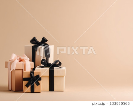 Elegant gift boxes with black and beige ribbons 133950566