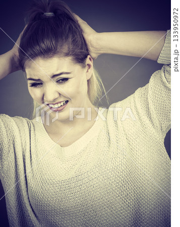 Unhappy woman screaming and yelling in pain Unhappy woman screaming and yelling in pain 133950972