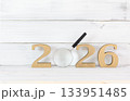 2026 New Year Goals Concept with Dartboard Target in Center Magnified Focus: New Year Concept with Magnifying Glass 133951485
