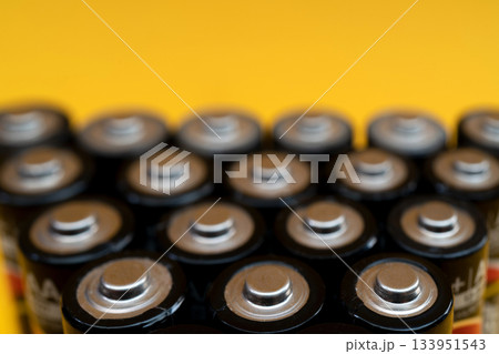 Used batteries are arranged in a triangle shape. Recycling and disposal of toxic waste. Used batteries are arranged in a triangle shape. Recycling and disposal of toxic waste. 133951543