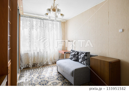 Inviting nostalgic living area characterized by classic design elements and multifunctional furnishings Inviting nostalgic living area characterized by classic design elements and multifunctional furnishings 133951582