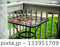 Autumn leaves on outdoor metal table on balcony Autumn leaves on outdoor metal table on balcony 133951709