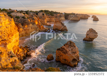 Marinha Beach, Cliffs and Atlantic Ocean in Sunny Morning. Portugal Marinha Beach, Cliffs and Atlantic Ocean in Sunny Morning. Portugal 133952372