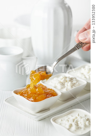 Mango jam and cottage cheese with cream. Mango jam and cottage cheese with cream. 133952380