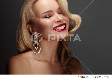 Beautiful Woman with Fashion Make-up and Blond Wave Hairstyle. Glamour American Diva Style with Brilliant Accessories Beautiful Woman with Fashion Make-up and Blond Wave Hairstyle. Glamour American Diva Style with Brilliant Accessories 133952660