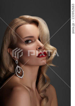 Beautiful Woman with Fashion Make-up and Blond Wave Hairstyle. Glamour American Diva Style with Brilliant Accessories Beautiful Woman with Fashion Make-up and Blond Wave Hairstyle. Glamour American Diva Style with Brilliant Accessories 133952663