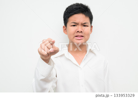 Angry Asian Teenage Boy Student Studio Portrait Pointing Finger at Camera 133953329