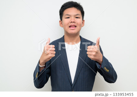 Asian Teenage Boy in Suit Studio Portrait Thumbs Up Approval Success Gesture 133953455
