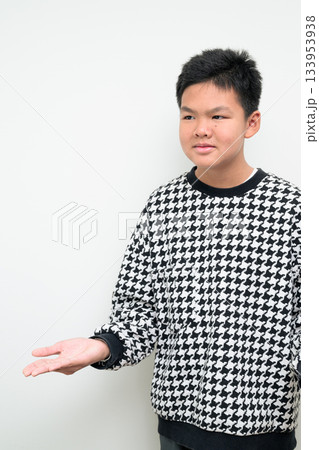 Asian Teenage Boy Studio Portrait on White Background Confused Shrugging Asian Teenage Boy Studio Portrait on White Background Confused Shrugging 133953938