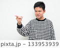 Angry Asian Teenage Boy Studio Portrait on White Background Pointing Finger 133953939