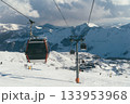 Ski lift in Gudauri, Georgia, transporting skiers through snowy mountains 133953968