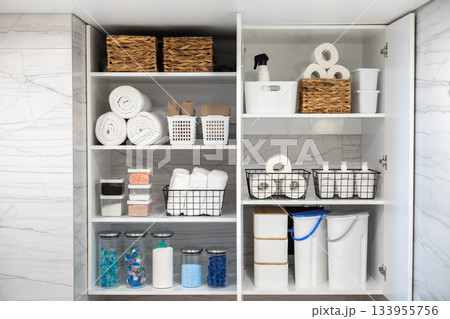 White bathroom laundry comfortable storage organizing arrangement on shelves eco style minimalism 133955756