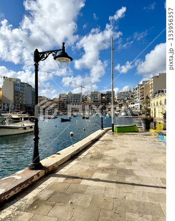 Small fishing boats moored in St Julians and Spinola bay Small fishing boats moored in St Julians and Spinola bay 133956357