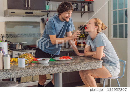 Woman and man preparing breakfast together in a bright kitchen, enjoying a warm morning routine. Home lifestyle, teamwork and cozy everyday living concept, reflecting connection, cooperation and a 133957207
