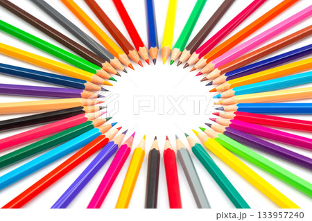 A circle of colorful pencils radiating outward on a white background, creating a vibrant frame 133957240