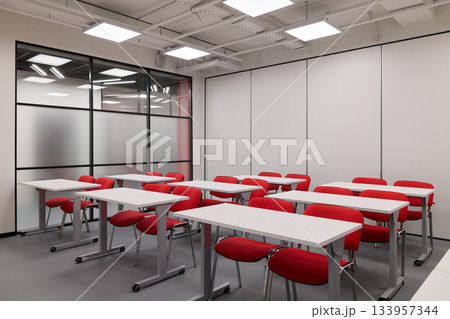 Neatly arranged training area featuring contemporary decor suitable for presentations and workshops Neatly arranged training area featuring contemporary decor suitable for presentations and workshops 133957344