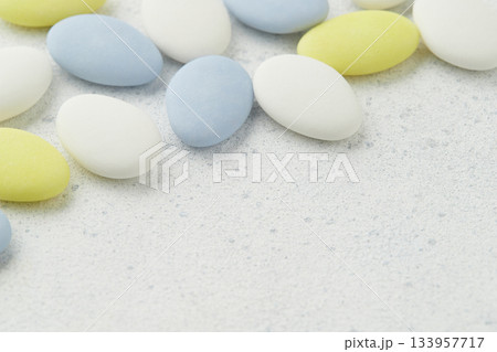 Traditional Easter Portuguese candies. White, yellow and blue sweets on grey background 133957717
