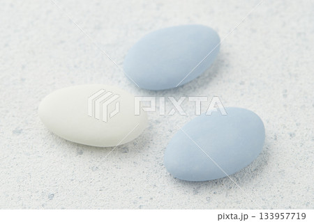 Traditional Easter Portuguese candies. White and blue sweets on grey background 133957719