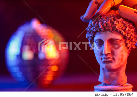 Sculpture Bust with Disco Ball and Wooden Hand in Neon Light 133957864