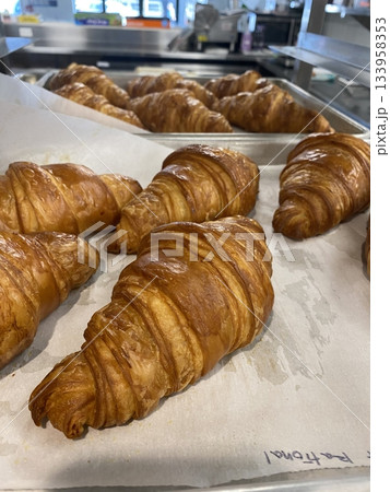 A croissant is a classic French pastry known for its buttery, flaky layers and golden crust. Often enjoyed plain or filled with chocolate, almond, or ham and cheese, it’s a perfect for breakfast A croissant is a classic French pastry known for its buttery, flaky layers and golden crust. Often enjoyed plain or filled with chocolate, almond, or ham and cheese, it’s a perfect for breakfast 133958353
