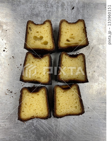 Canelé, a classic French pastry with a caramelized crust and soft, custard-like center, infused with vanilla and rum. Perfect for dessert photography, showcasing the elegant texture and rich flavor. Canelé, a classic French pastry with a caramelized crust and soft, custard-like center, infused with vanilla and rum. Perfect for dessert photography, showcasing the elegant texture and rich flavor. 133960151