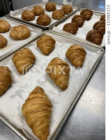 A croissant is a classic French pastry known for its buttery, flaky layers and golden crust. Often enjoyed plain or filled with chocolate, almond, or ham and cheese, it’s a perfect for breakfast A croissant is a classic French pastry known for its buttery, flaky layers and golden crust. Often enjoyed plain or filled with chocolate, almond, or ham and cheese, it’s a perfect for breakfast 133960153
