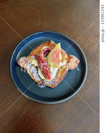 A croissant is a classic French pastry known for its buttery, flaky layers and golden crust. Often enjoyed plain or filled with chocolate, almond, or ham and cheese, it’s a perfect for breakfast 133961542