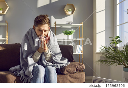 Man gets frozen in his apartment because of the low temperature indoors during a cold winter Man gets frozen in his apartment because of the low temperature indoors during a cold winter 133962306