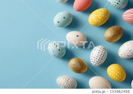 Colorful and decorative Easter eggs with patterns arranged on a pastel blue backdrop 133962498