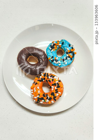 Three Colorful Donuts With Sprinkles Three Colorful Donuts With Sprinkles 133963606