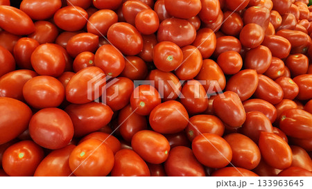 Fresh Red Cherry Tomatoes Piled High, Small Grape Tomatoes for Market and Cooking 133963645