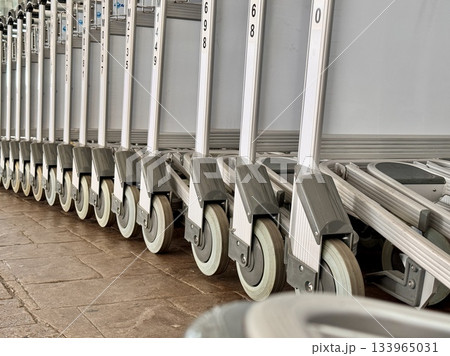 Trolleys for transporting luggage at the airport Trolleys for transporting luggage at the airport 133965031