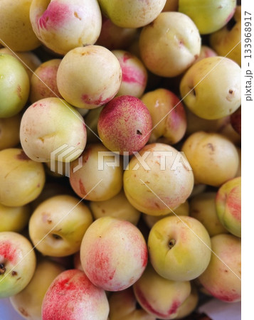 stack of fresh yellow nectarines. Top view 133968917