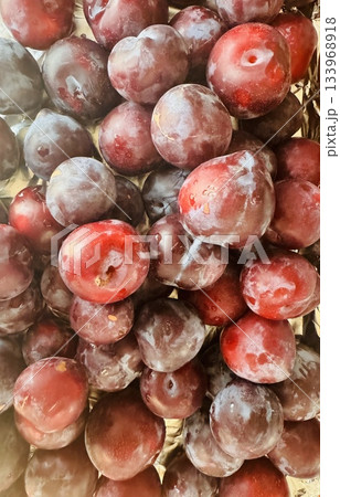 stack of fresh plums. Top view 133968918