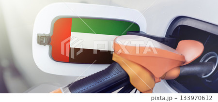 The flag of the United Arab Emirates on the lid of the gas tank of a car at a gas station in close-up. High or low gasoline prices at UAE gas stations. Gasoline prices are rising due to a shortage of The flag of the United Arab Emirates on the lid of the gas tank of a car at a gas station in close-up. High or low gasoline prices at UAE gas stations. Gasoline prices are rising due to a shortage of 133970612