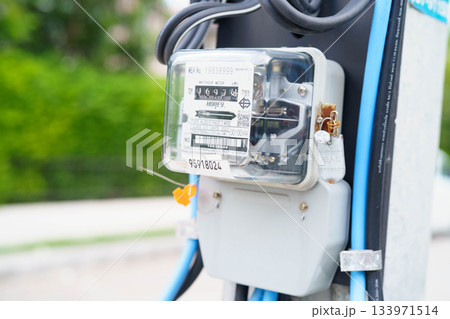 Bangkok, Thailand April 7, 2025 Electric measuring power meter for energy cost at home and office. 133971514