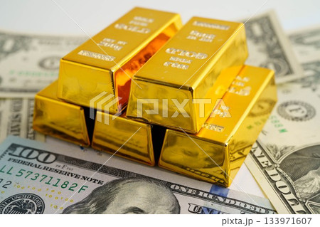 Gold bars on US dollar banknote money, finance trading investment business currency concept. 133971607
