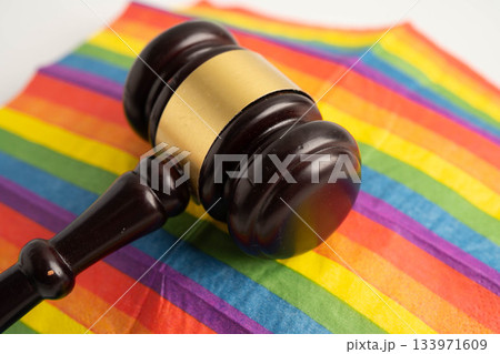 Gavel for judge lawyer on rainbow flag, symbol of LGBT pride month. Gavel for judge lawyer on rainbow flag, symbol of LGBT pride month. 133971609