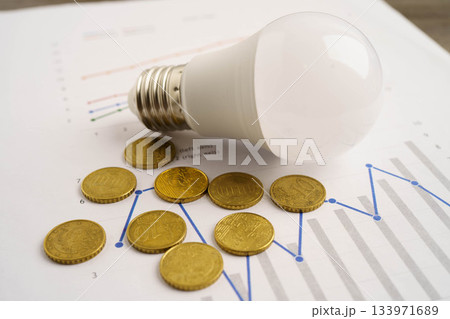 Cost of electric utilities with light bulb for payment. Cost of electric utilities with light bulb for payment. 133971689