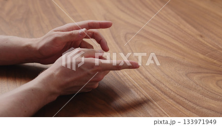 man hand suggestions gesture on black walnut table man hand suggestions gesture on black walnut table 133971949