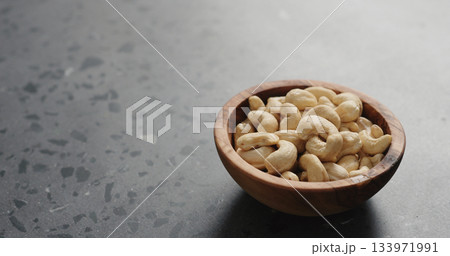cashew nuts in olive bowl on terrazzo countertop 133971991