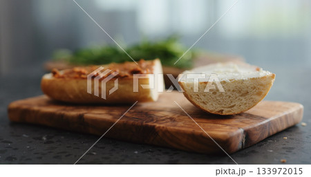ciabatta sandwich with red pesto and cream cheese on terrazzo countertop 133972015