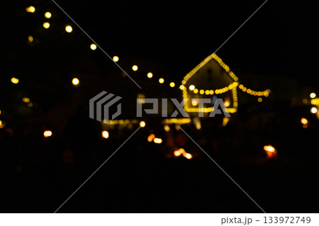 Blurred Night View of a Festive European Street with Warm Decoration. 133972749