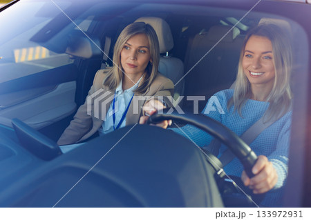 Driving Lesson Success with Confident Student and Calm Instructor 133972931