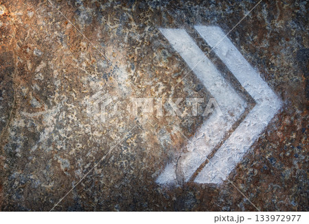 White Directional Arrow Painted on Stone Surface stock photo White Directional Arrow Painted on Stone Surface stock photo 133972977