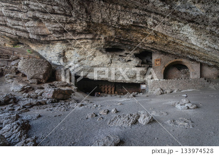 A rocky grotto with stone arches on the Golitsyn Trail in Novy Svet 133974528