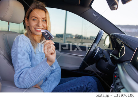 Excited Young Driver Holding Car Keys After Passing Test 133976106