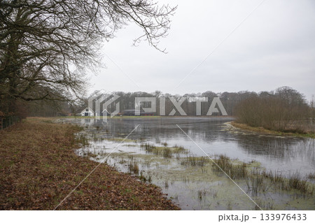 High water freezes at Monnikenberg Estate in Hilversum Netherlands during winter season High water freezes at Monnikenberg Estate in Hilversum Netherlands during winter season 133976433