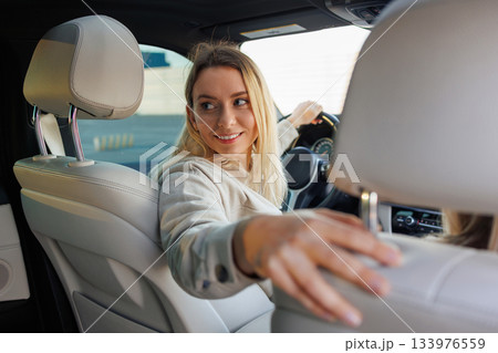 Learner Driver Checking Rear View During Driving Practice Learner Driver Checking Rear View During Driving Practice 133976559